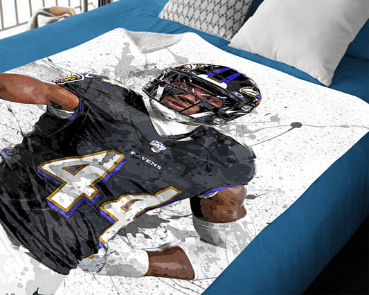 Manta polar con efecto salpicado de Marlon Humphrey