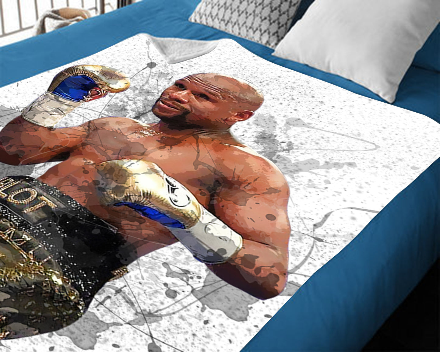 Manta polar con efecto salpicado y el logo de Floyd Mayweather